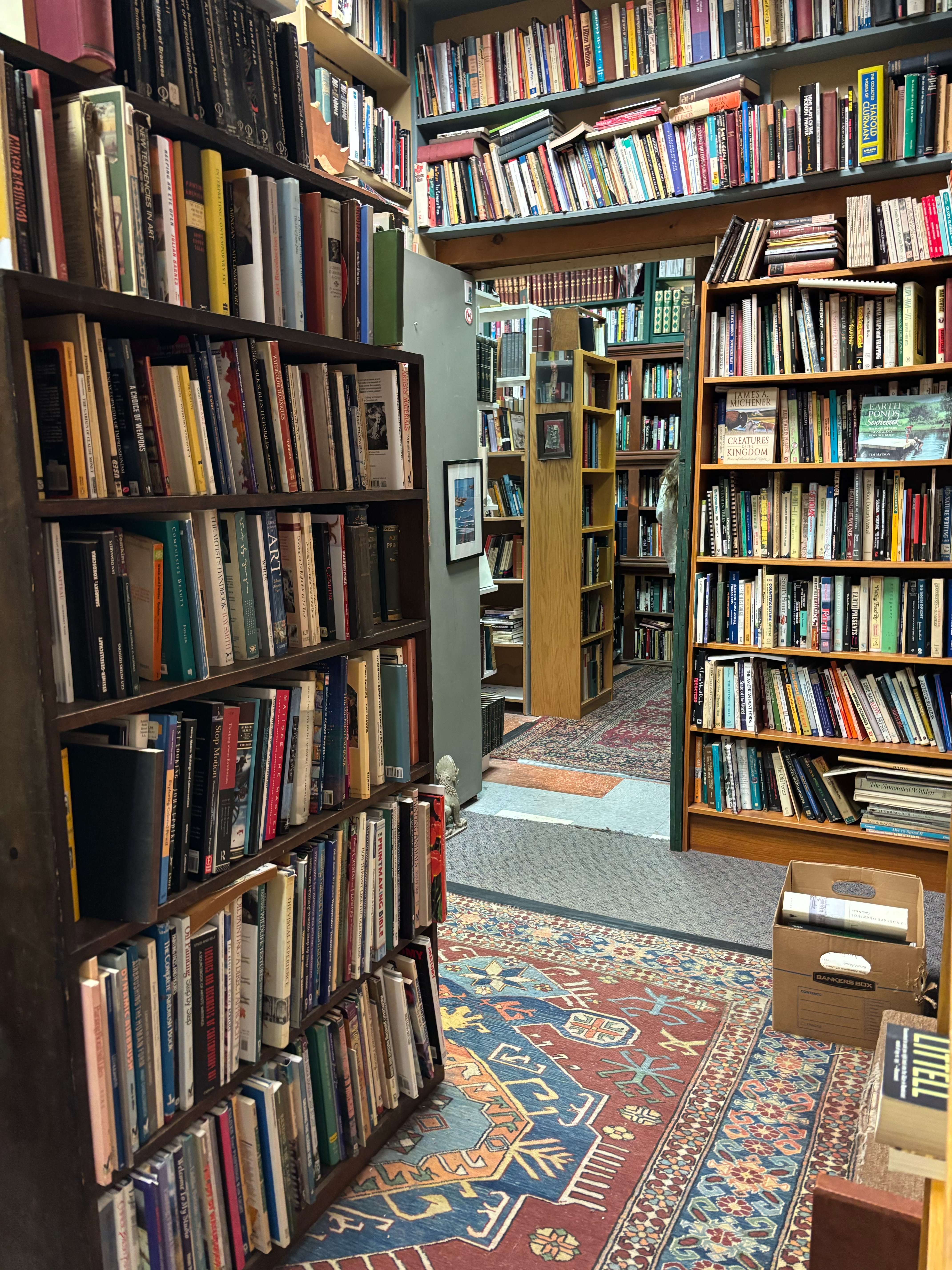 A maze of overstuffed floor-to-ceiling bookshelves