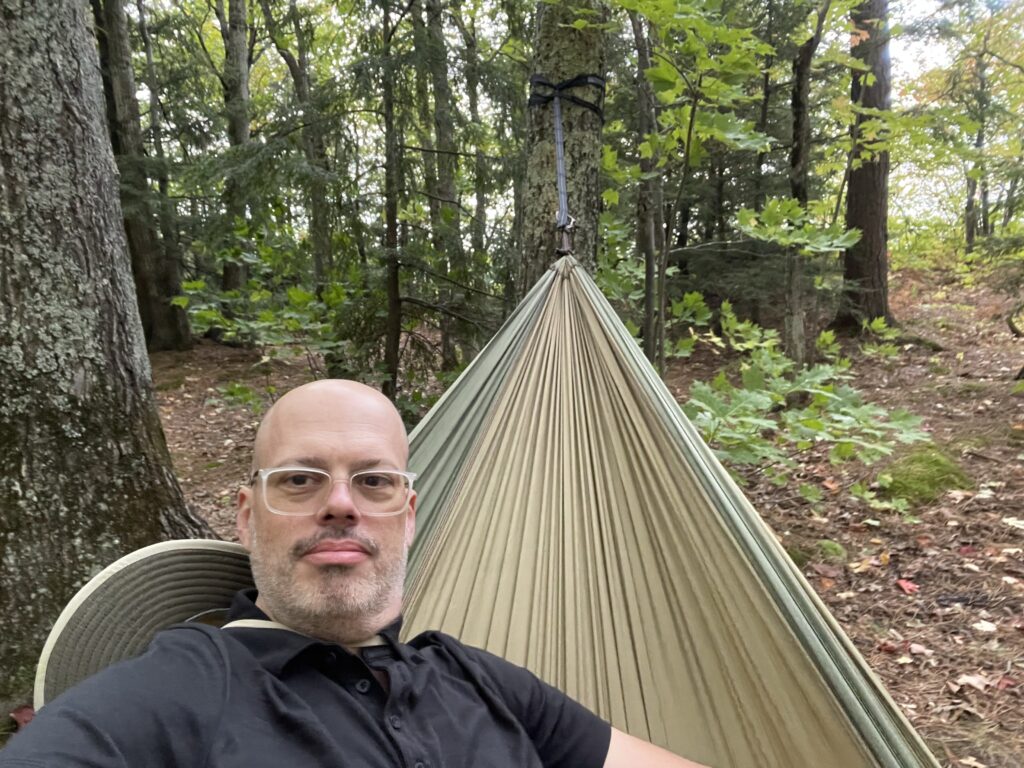 Me in my hammock with the woods behind me 